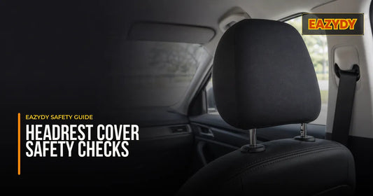 Plain dark cover fitted to a removable two-post headrest in a parked car