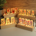 Resin word lamps with dried flowers spelling LOVE, MAMA, DAD and MOM