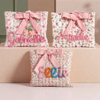 Quilted floral bow pouches with names stitched in chenille
