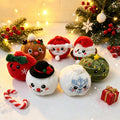 Christmas plush squishies shaped like Santa, a snowman, a reindeer and a tree
