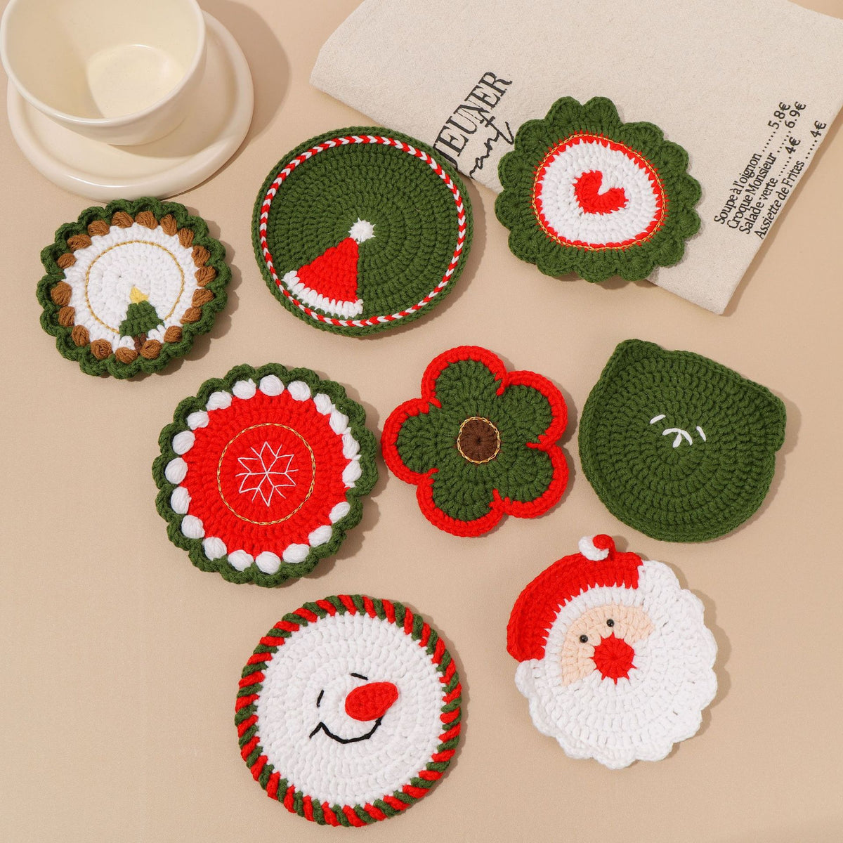 Crocheted Christmas coasters with Santa, snowman and snowflake designs
