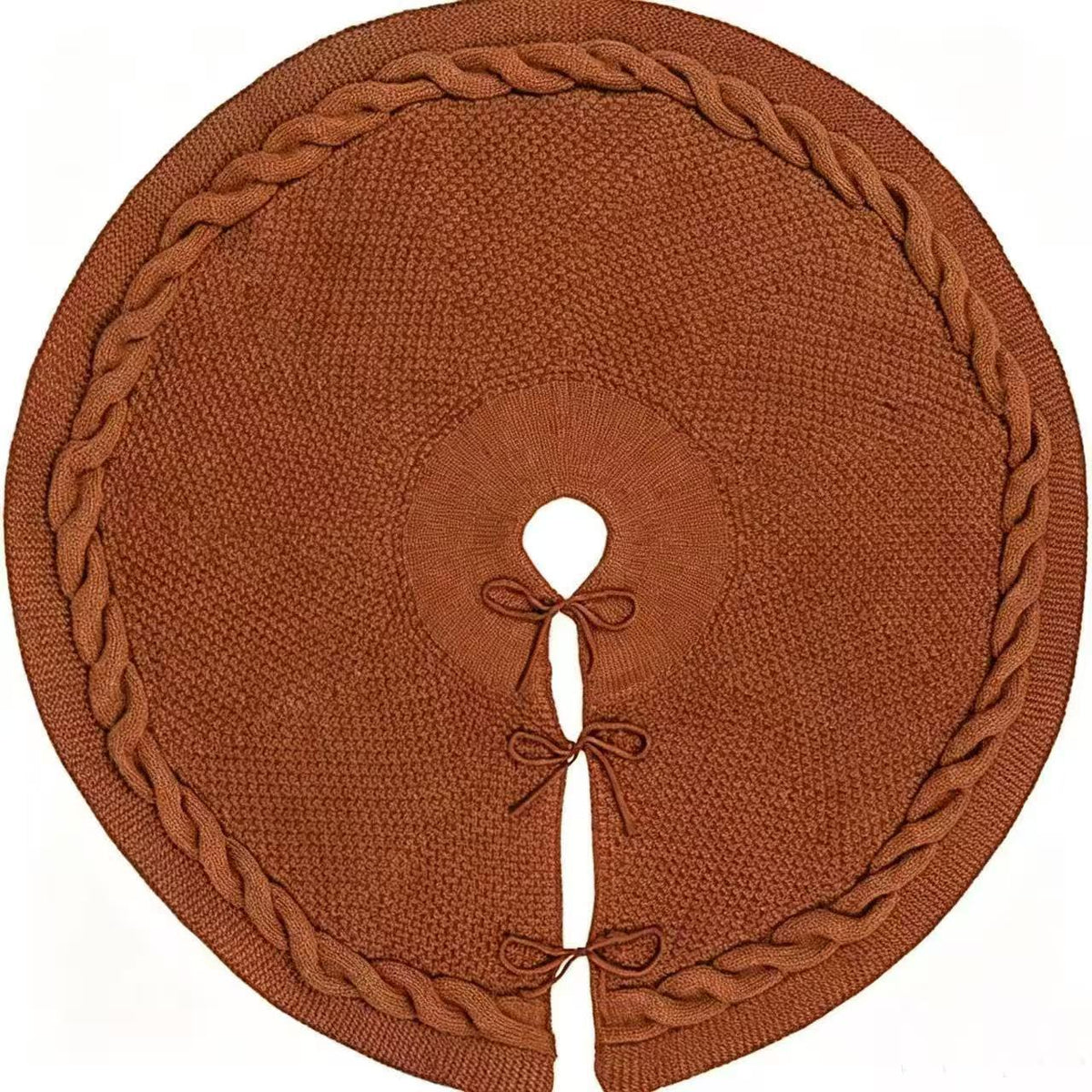 Brown knitted tree skirt with a braided border and bow ties