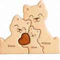 Wooden cat family puzzle engraved with the names Emma, Olivia and William