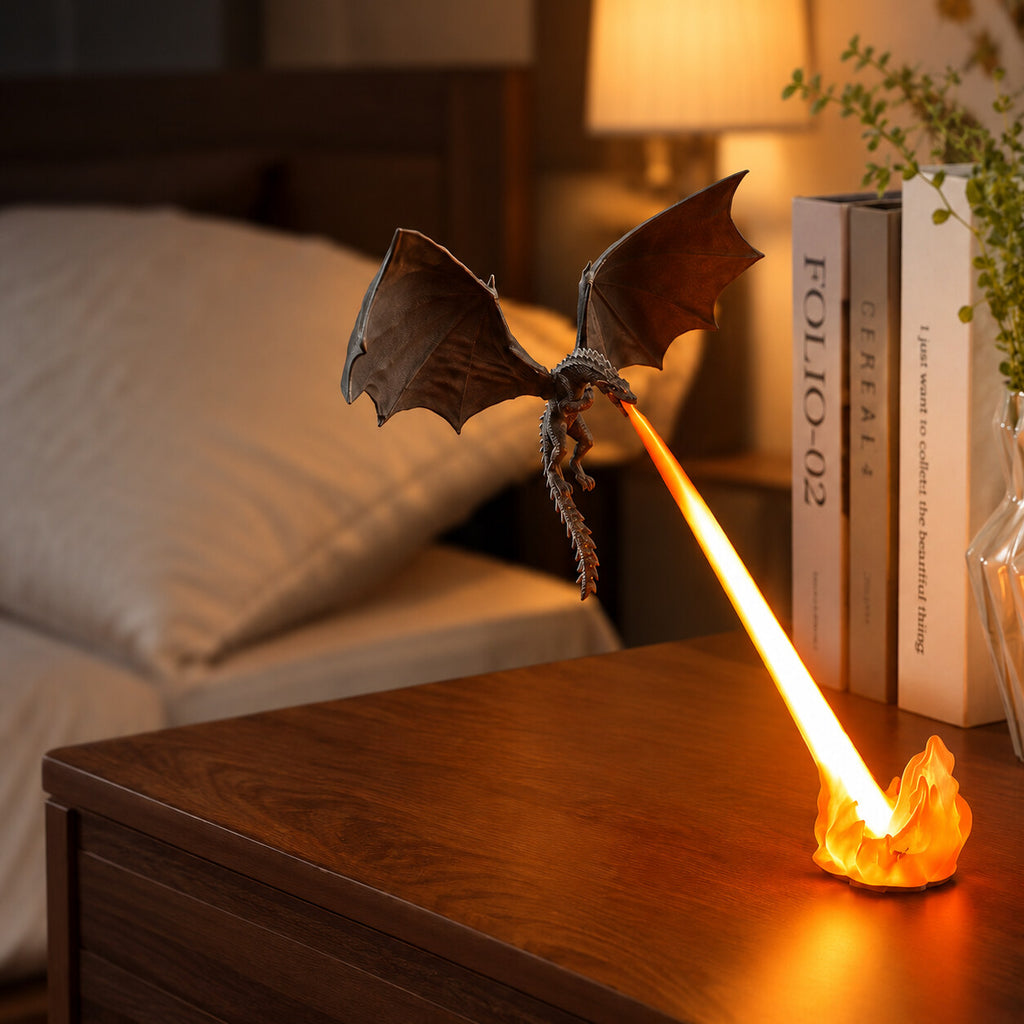 Dragon night light breathing an orange flame on a bedside table