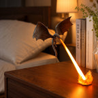 Dragon night light breathing an orange flame on a bedside table