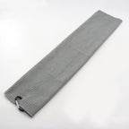 Gray golf towel laid flat with its bag clip