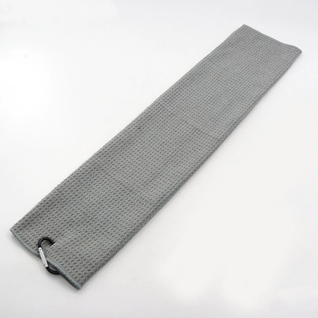 Gray golf towel laid flat with its bag clip