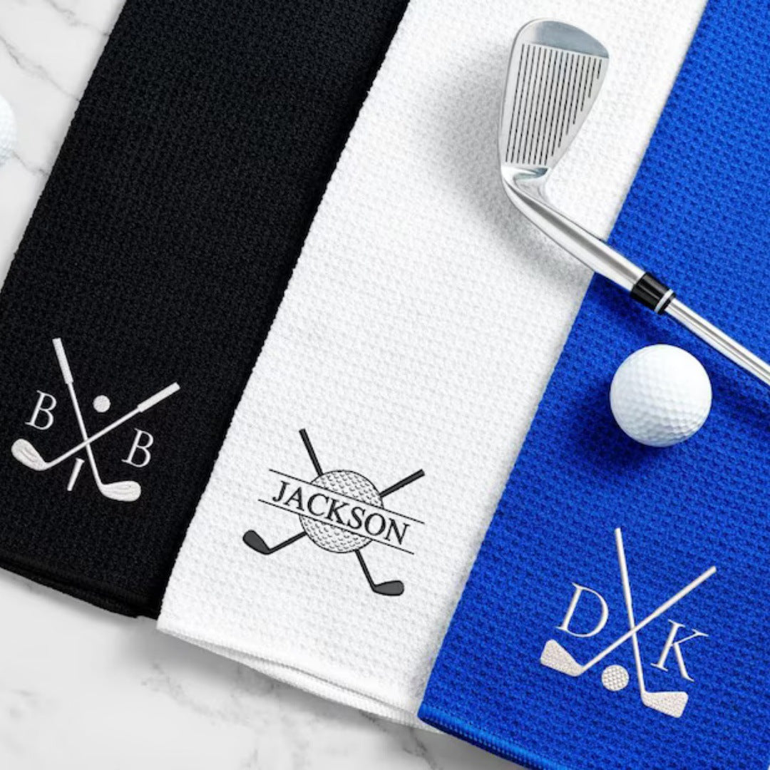 Black, white and blue waffle golf towels with BB and DK monograms and a Jackson crossed clubs design