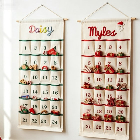 Two personalized advent calendars embroidered with the names Daisy and Myles, pockets filled with small treats