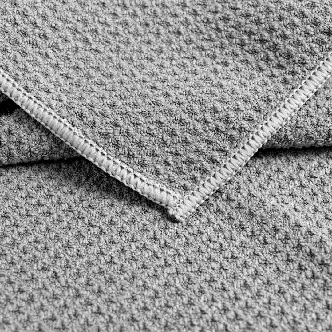 Close-up of the waffle weave and stitched edge of a quick-dry golf towel