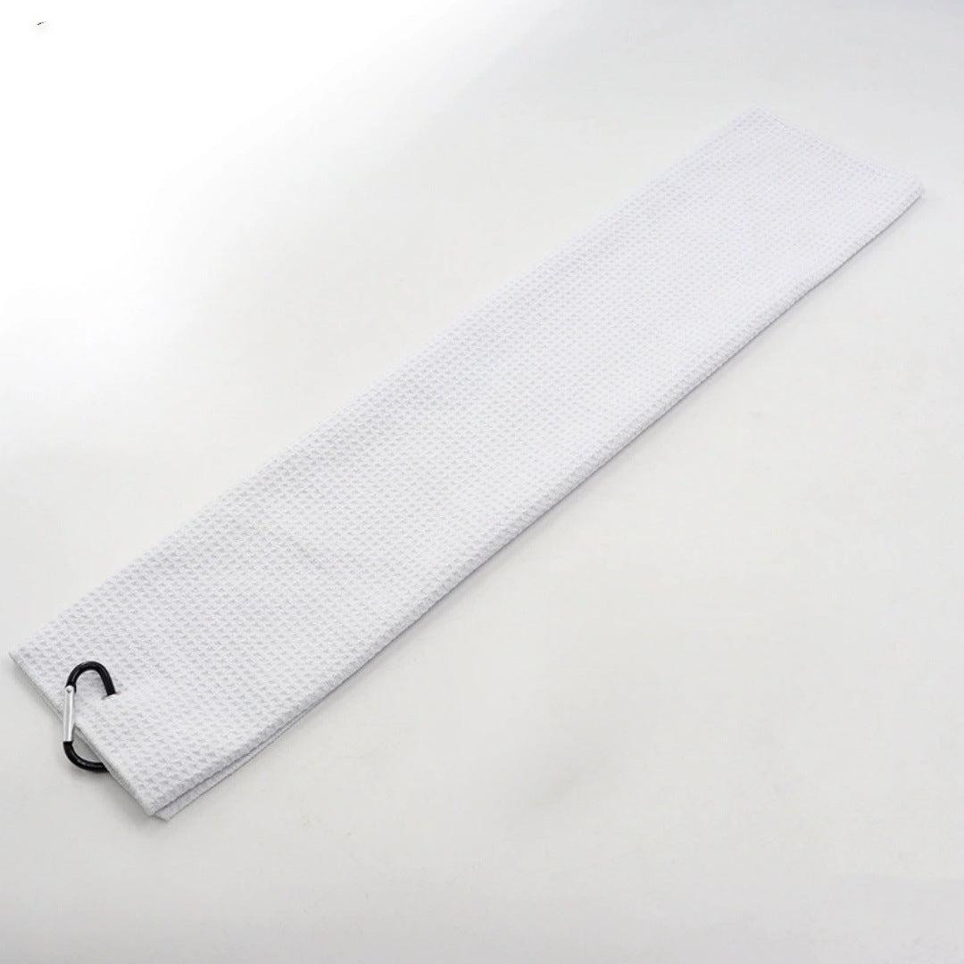 White golf towel laid flat with its carabiner